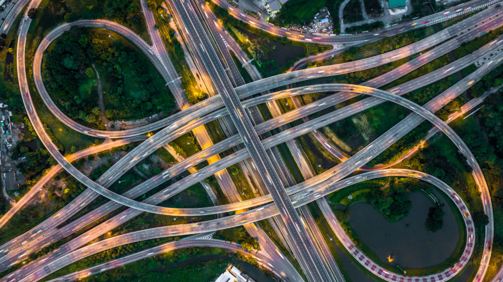 Top,View,Over,The,Highway,,Expressway,,Motorway,At,Night,,Aerial