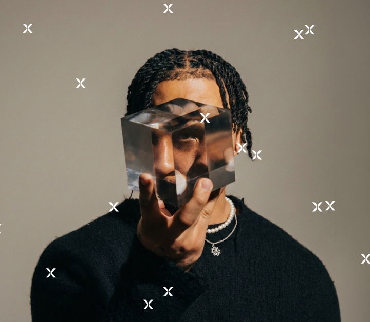 Man holding glass cube